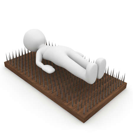 A fakir is on steel nails.の写真素材