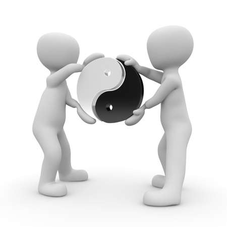 Two characters hold the symbol of Yin and Yang in the air.の写真素材