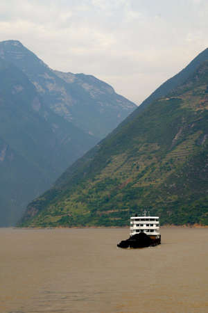 scenery along the Yangtze River in China including huge ship and mountainsの写真素材