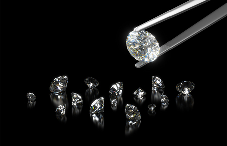 Luxury diamond in tweezers closeup with dark backgroundの写真素材
