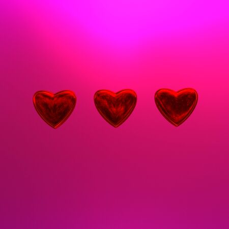 three hearts on a pink backgroundの写真素材