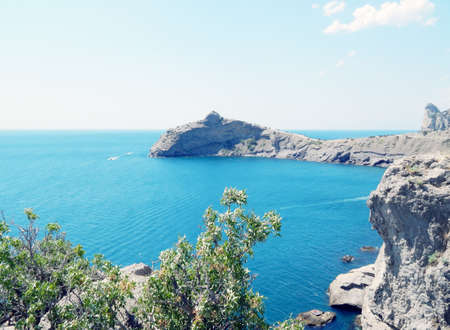 mountains and sea on a sunny dayの写真素材