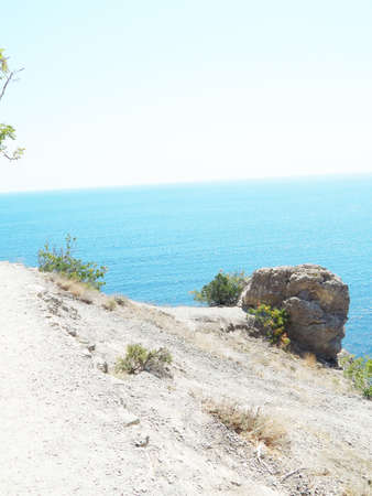 rocks mountains and sea on a sunny dayの写真素材