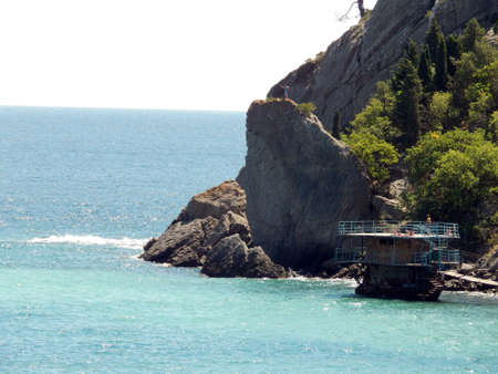rocks in the sea, sunny, lonely pine, spruce on a rock, mysterious, romanticの写真素材