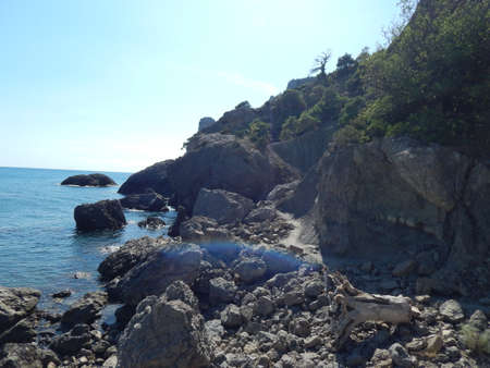 rocks in the sea, sunnyの写真素材