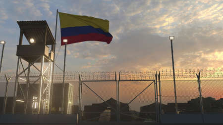 National flag of Colombia above military base at sunsetの写真素材