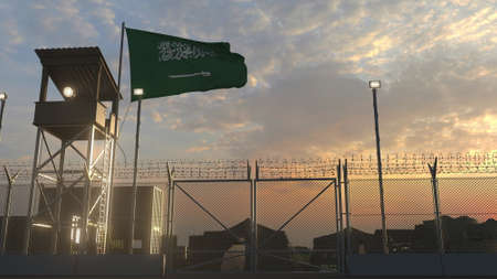 Waving flag of Saudi arabia above military base in the eveningの写真素材