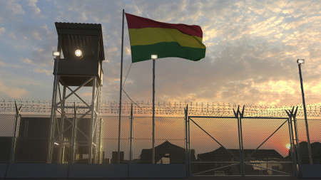 Flying flag of Bolivia above military base in the eveningの写真素材