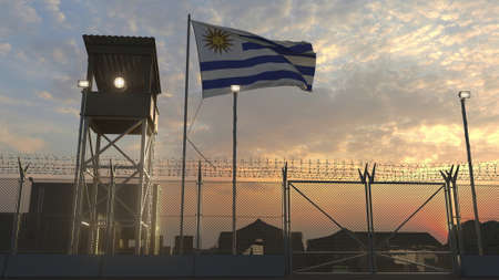 Waving flag of Uruguay above military base in the eveningの写真素材