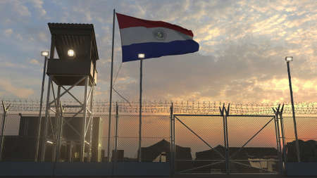 Waving flag of Paraguay above military base in the eveningの写真素材