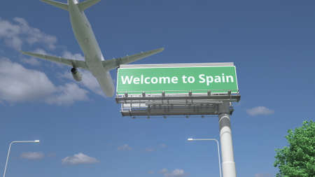Plane flying over WELCOME TO SPAIN road sign 3d renderingの写真素材