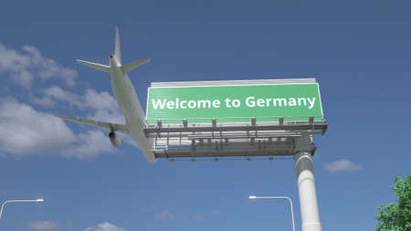 Plane flying over WELCOME TO GERMANY road sign 3d renderingの写真素材