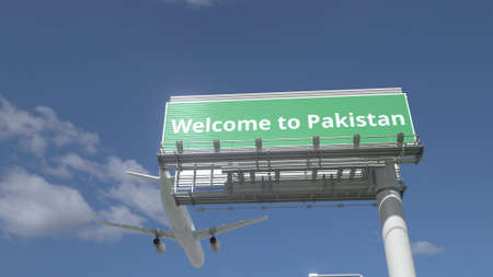 Airplane flies over WELCOME TO PAKISTAN highway sign 3d renderingの写真素材