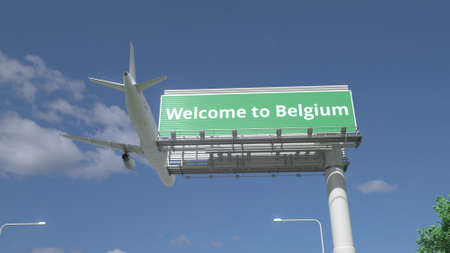 Plane flying over WELCOME TO BELGIUM road sign 3d renderingの写真素材