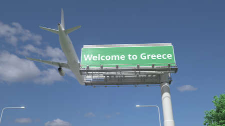 Arriving plane flies over WELCOME TO GREECE road sign 3d renderingの写真素材