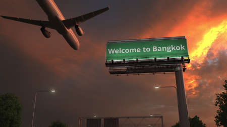 Airplane flies above WELCOME TO BANGKOK highway sign in the evening, 3d renderingの写真素材