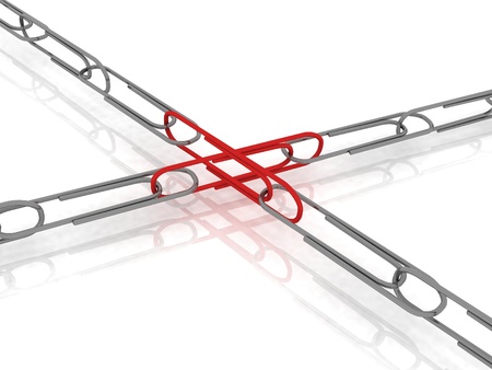 Chain of paper clips with the crossing redの写真素材