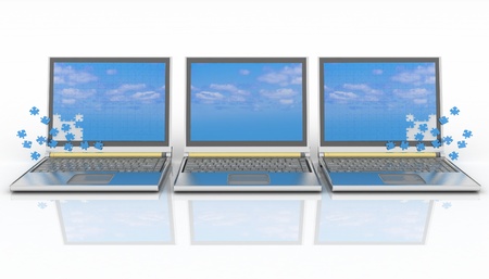 three laptops with a screen from puzzle on white backgroundの写真素材