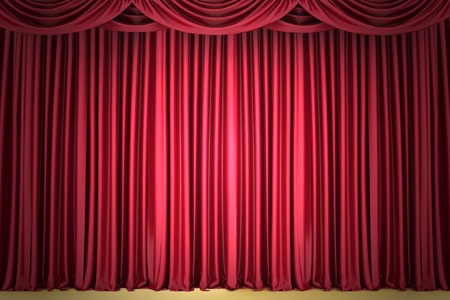 Red closed the curtain, lit by a spotlightの写真素材