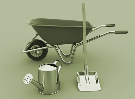 Garden tools. Garden wheelbarrow, watering can and a shovel.の写真素材