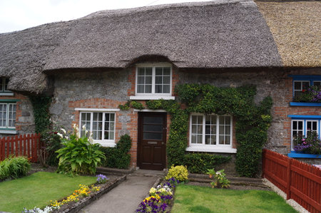 Adare, County Limerick, Ireland: traditional thatched cottage with front gardenのeditorial素材