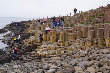 Bushmills, Northern Ireland: visitors on top of the basalt columns of the Giant's Causewayのeditorial素材