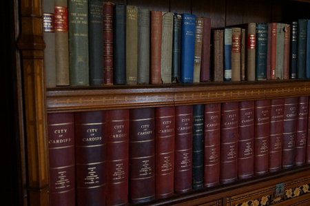 Cardiff, Wales (UK): interior of Cardiff Castle, books on a bookshelf of the Libraryのeditorial素材