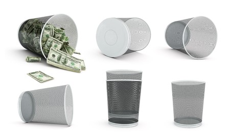 Garbage basket of complete money on a white backgroundの写真素材