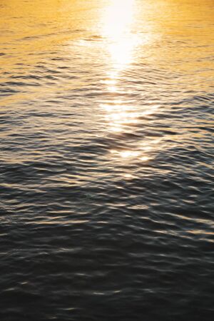 Sunset - sun reflecting in sea/ ocean
