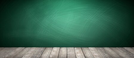 Rubbed out chalk on a greenboard, wooden floor