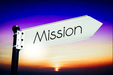Mission - signpost with one arrow, sky in background