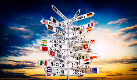 Signpost with national flags of different countries, sky in background - 3D illustrationの写真素材