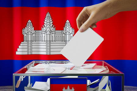 Cambodia flag, hand dropping ballot card into a box - voting, election concept - 3D illustrationの写真素材