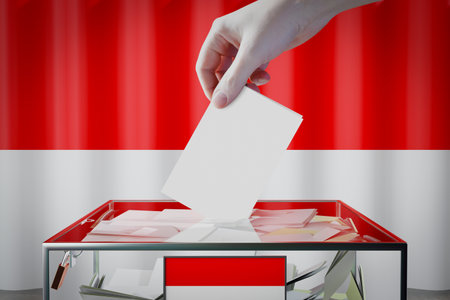 Hesse flag, hand dropping ballot card into a box - voting/ election in Germany concept - 3D illustrationの写真素材