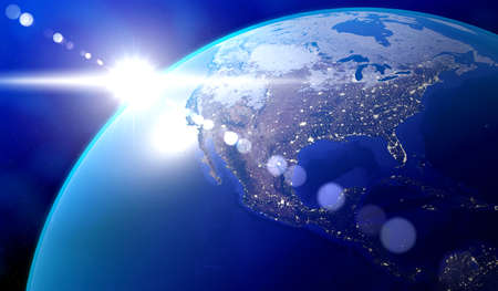 Earth, North America side - sun glare and city lights in major cities in the USA and Mexico.の写真素材