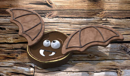 Halloween bat cookie on wooden background - 3D illustration