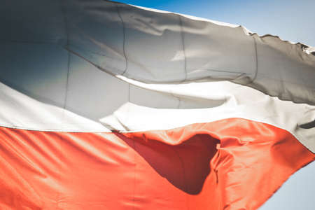 Material flag of Poland, sky in backgroundの写真素材
