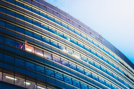 Round modern glass office building - business concept