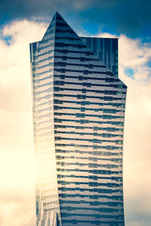 Modern glass skyscraper, office building - business concept
