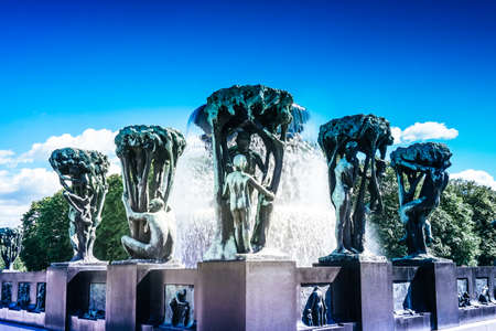 Norway, Oslo, Frogner Park, Gustav Vigeland Sculpture Park, June 12th, 2016 - Fountain with sculptures of people and treesのeditorial素材