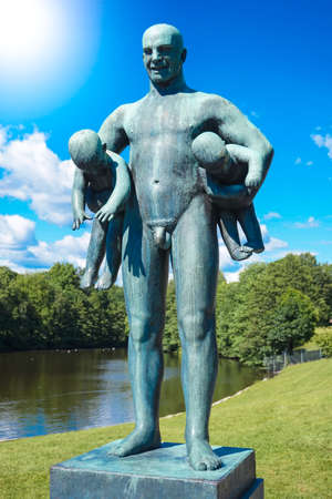 Norway, Oslo, Frogner Park, Gustav Vigeland Sculpture Park, June 12th, 2016 - Sculpture of a man holding two childrenのeditorial素材
