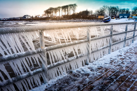 Icicles hanging on footbridge - frost, winter conceptの写真素材