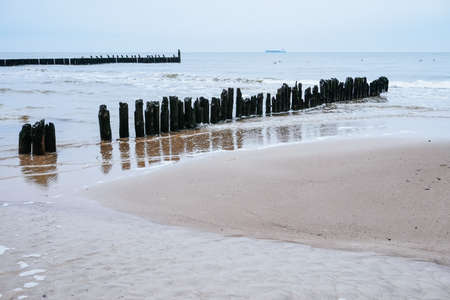 Old groyne on a shore