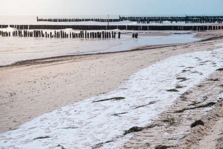 Snow on a beach - winter timeの写真素材