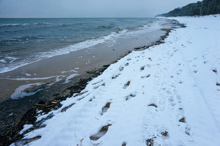 Snow on a beach - winter timeの写真素材