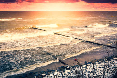Groynes on a shore, Baltic Sea, Poland, winter timeの写真素材