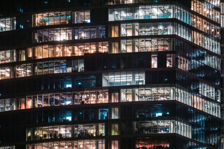 Office building with glass facade - night photographのeditorial素材