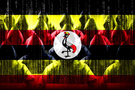 Anonymous hooded hackers, flag of Uganda, binary code - cyber attack conceptの写真素材