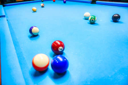 Billiards game - coloful balls on a tableの写真素材