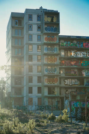 Warsaw, Poland, June 5th 2022 - Unfinished residential building covered with graffiti - abandoned...